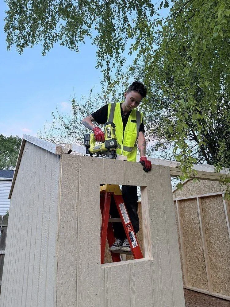 Kate, owner of EasyFix Handyman Services, building a shed